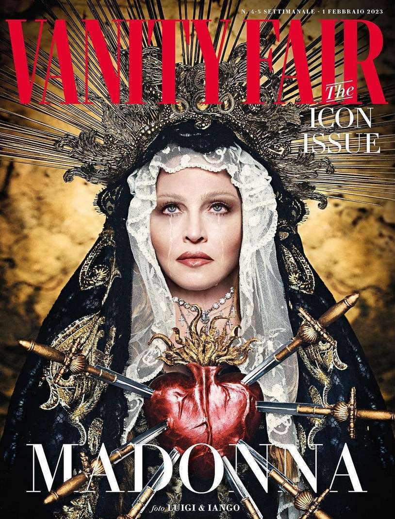 Vanity Fair cover featuring Madonna with a heart pierced by swords, elaborate headpiece, and dark robes against a gold backdrop.