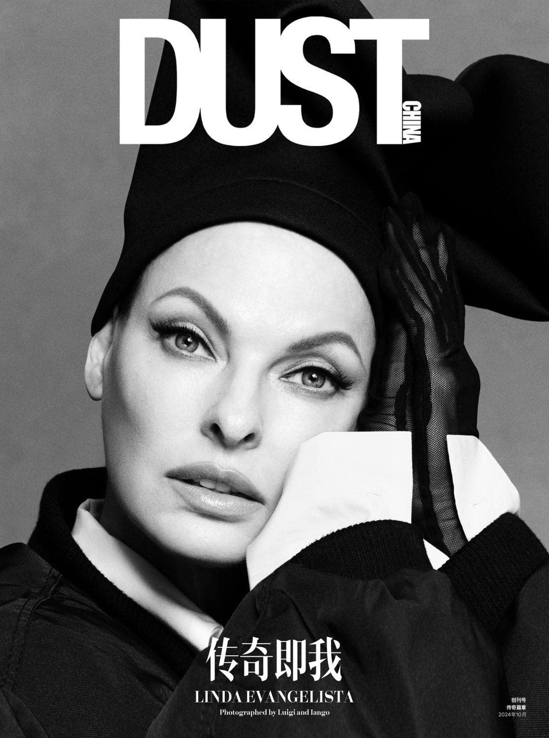 Black-and-white portrait of Linda Evangelista on the cover of Dust China, wearing a black top and head covering, with translucent gloves.