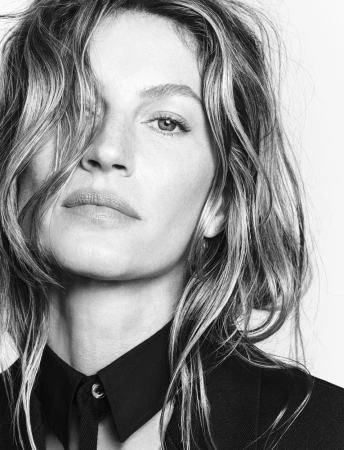 Close-up portrait of Gisele Bündchen wearing a black collared shirt against a white background, photographed by Luigi & Iango