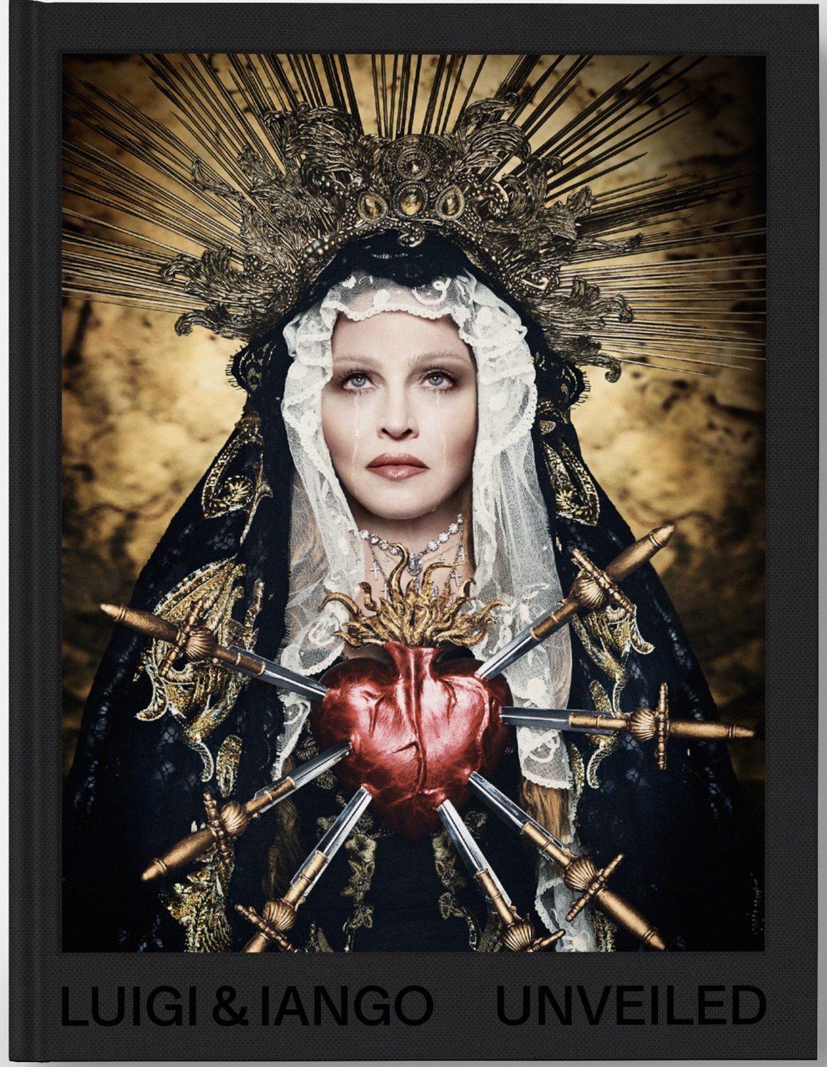 Luigi & Iango's portrait of a woman with a heart pierced by swords, wearing a veil and crown. Gold and dark color palette.