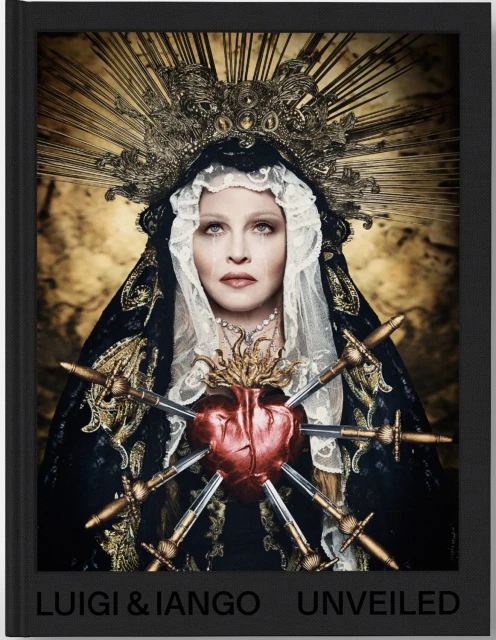 Luigi & Iango's portrait of a woman with a heart pierced by swords, wearing a veil and crown. Gold and dark color palette.