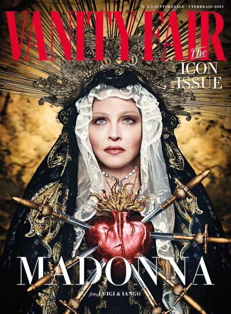 Vanity Fair magazine cover featuring Madonna wearing a crown and head covering, with swords piercing a heart emblem.