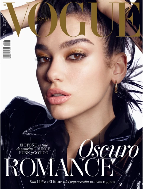 Vogue Espana cover featuring a close-up of a woman with golden eyeshadow and dark jacket. The cover has bold text and magazine details.