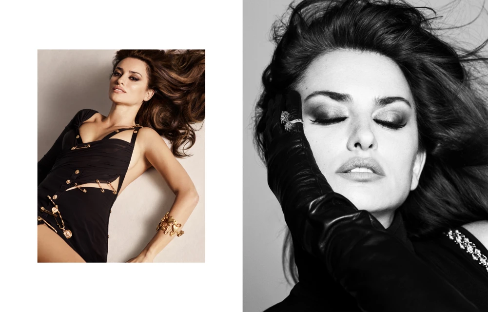 Fashionable woman in black dress with safety pin details and jewelry lying down in a studio for beauty and fashion photography.