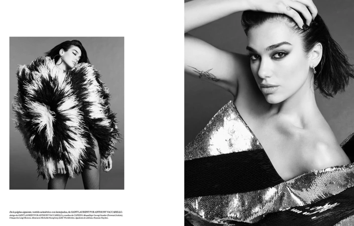 Black and white editorial portrait of Dua Lipa wearing a sequined top and feathered coat photographed by Luigi and Iango.