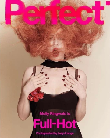 Magazine cover featuring a woman with vibrant red hair and dark clothing, against a tan backdrop with bright pink 'Perfect' masthead.