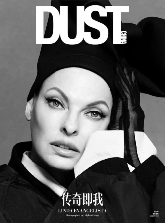 Black and white portrait of Linda Evangelista wearing a sculptural black hat and sheer gloves, photographed by Luigi and Iango.