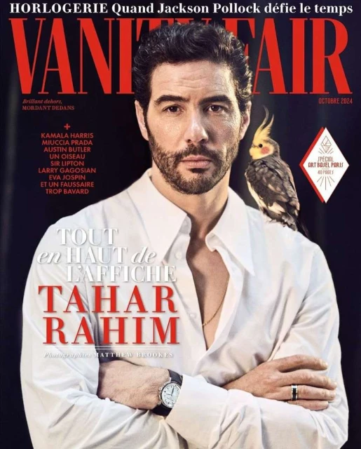 Vanity Fair cover featuring Tahar Rahim with a cockatiel perched on his shoulder, set against a dark background with magazine text.