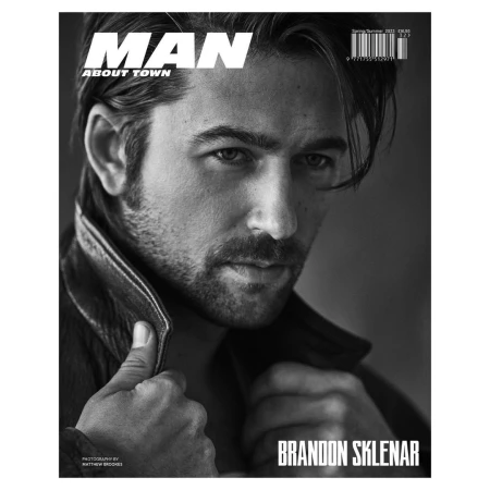 Black and white portrait of actor Brandon Sklenar on Man About Town magazine cover wearing a dark leather jacket