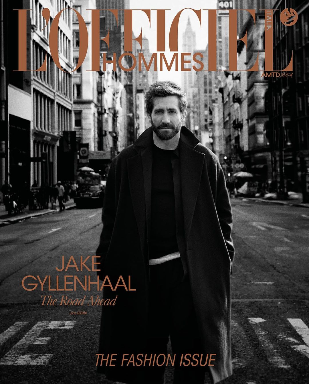 Magazine cover featuring Jake Gyllenhaal on a city street in a dark coat. L'Officiel Hommes header. Fashion issue focus.