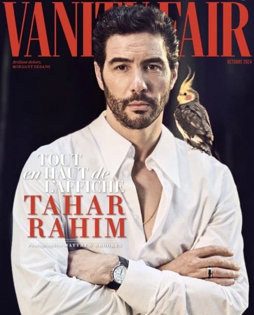 Vanity Fair cover featuring Tahar Rahim in a white shirt with a bird perched on his shoulder, against a dark background.