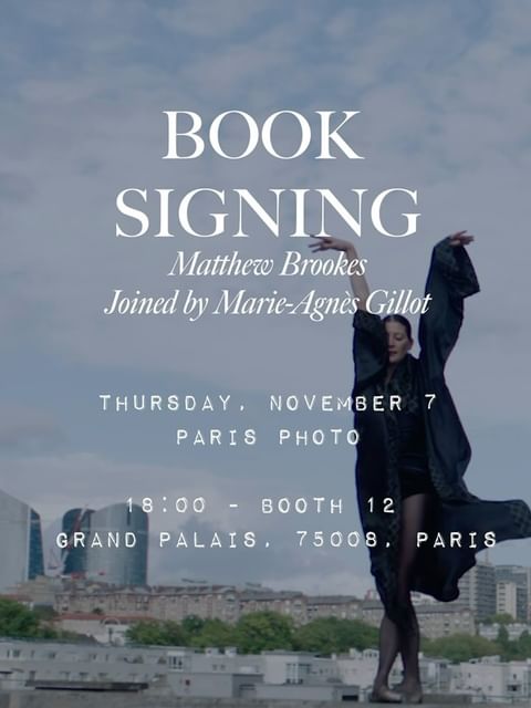 Elegant event poster featuring a woman in flowing robe striking a pose against a Paris cityscape, advertising a book signing.