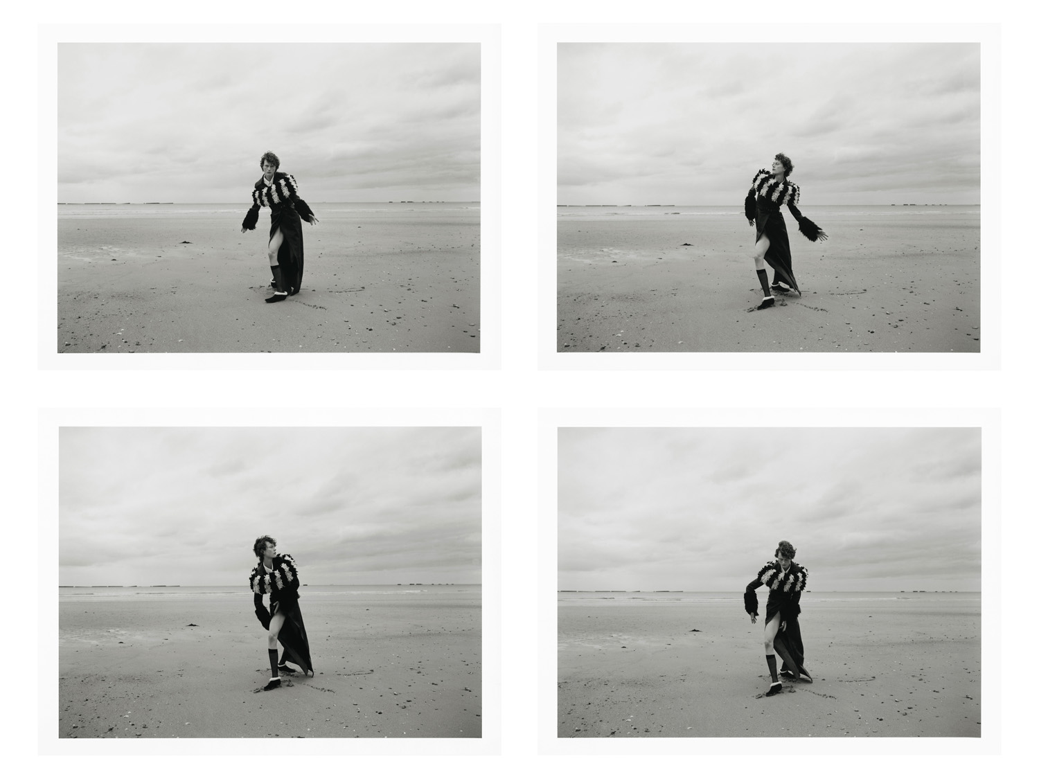 A four-panel black and white photographic print showing a model posing on a wide sandy beach under an overcast sky.