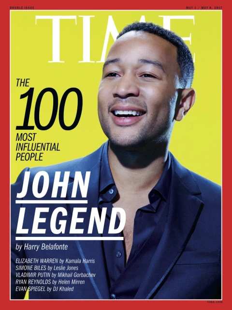 John Legend smiles on Time Magazine cover with yellow background and red frame. Text: TIME, The 100 Most Influential People, John Legend.