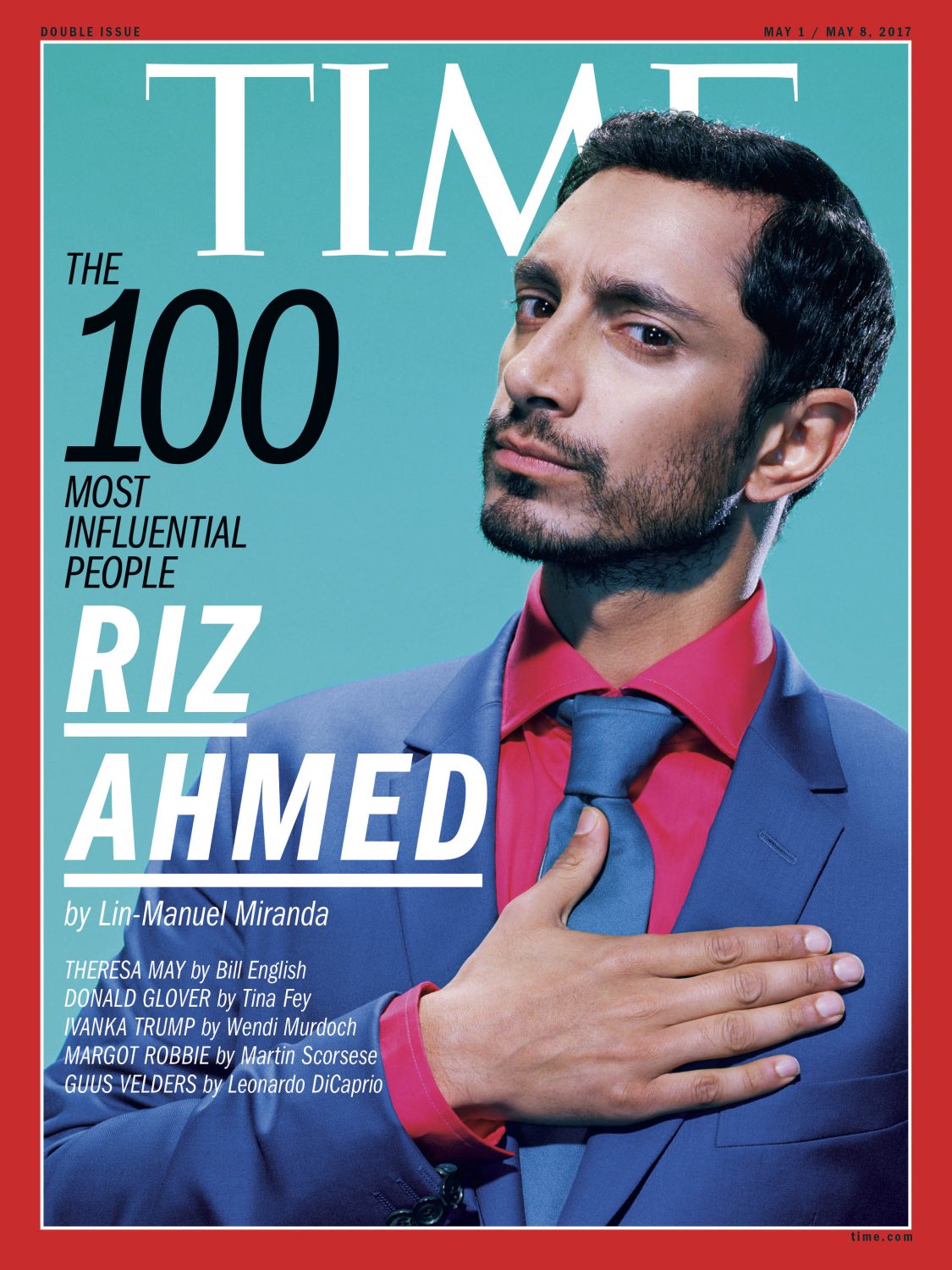 Time Magazine cover featuring Riz Ahmed in a blue suit and pink shirt against a light blue backdrop with red border.