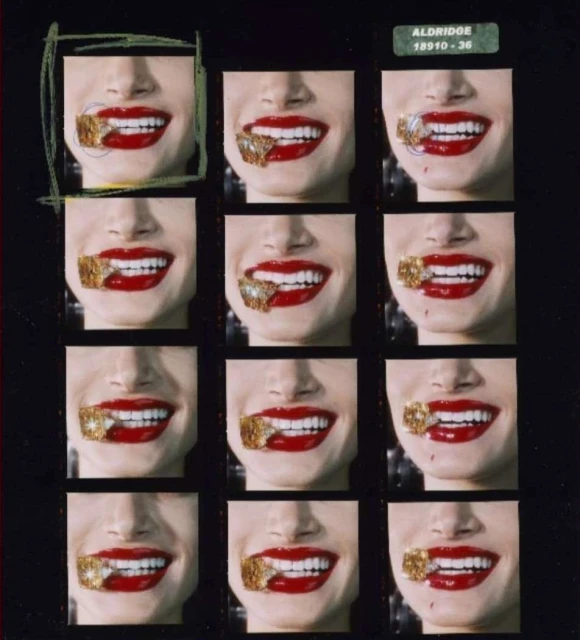 Multiple images of a woman's face with red lipstick and gold covering her mouth, arranged in a grid on a black background.