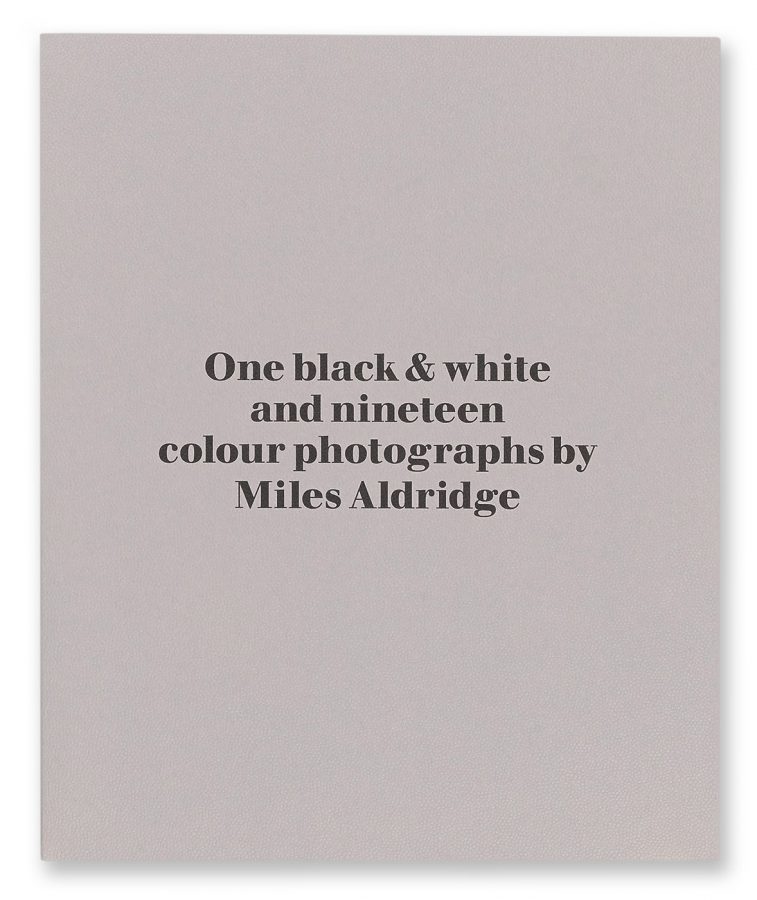 Book cover: 'One black & white and nineteen colour photographs by Miles Aldridge'. Light gray background with black text.