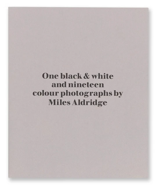 Book cover: 'One black & white and nineteen colour photographs by Miles Aldridge'. Light gray background with black text.