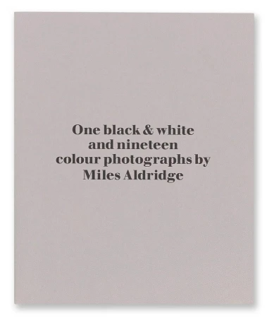 Book cover: 'One black & white and nineteen colour photographs by Miles Aldridge'. Light gray background with black text.