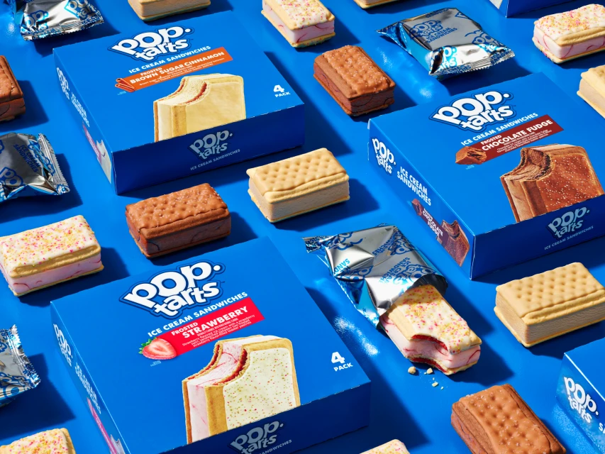 Pop-Tarts ice cream sandwiches in various flavors including strawberry, chocolate fudge, and brown sugar cinnamon on a blue background.