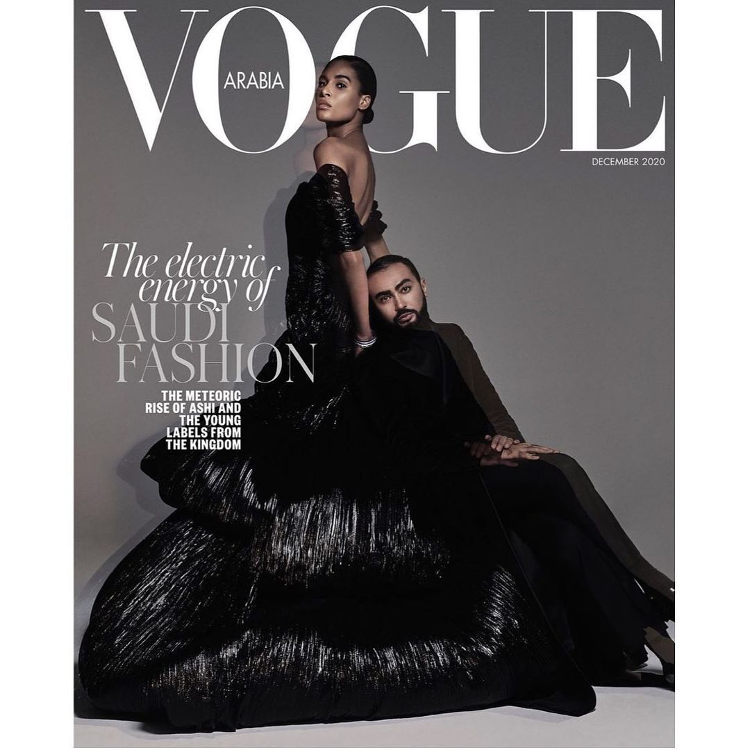 Vogue Arabia December 2020 magazine cover featuring a fashion model in a voluminous black dress alongside a male figure in a suit.
