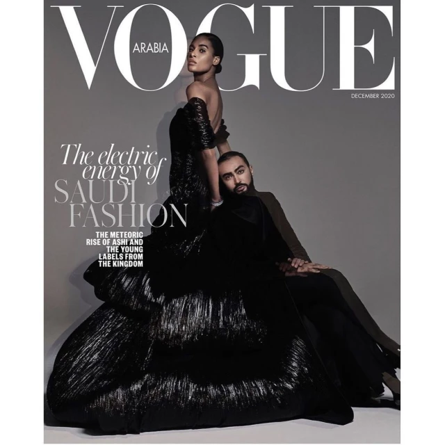 Vogue Arabia December 2020 magazine cover featuring a fashion model in a voluminous black dress alongside a male figure in a suit.