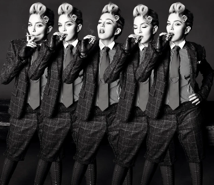 Black and white fashion shot of five instances of the same adult woman smoking a cigarette in a plaid suit with a tie and dress shoes.