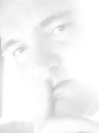 Close-up portrait of a man with hand near mouth in high-key monochrome lighting by Tom Munro