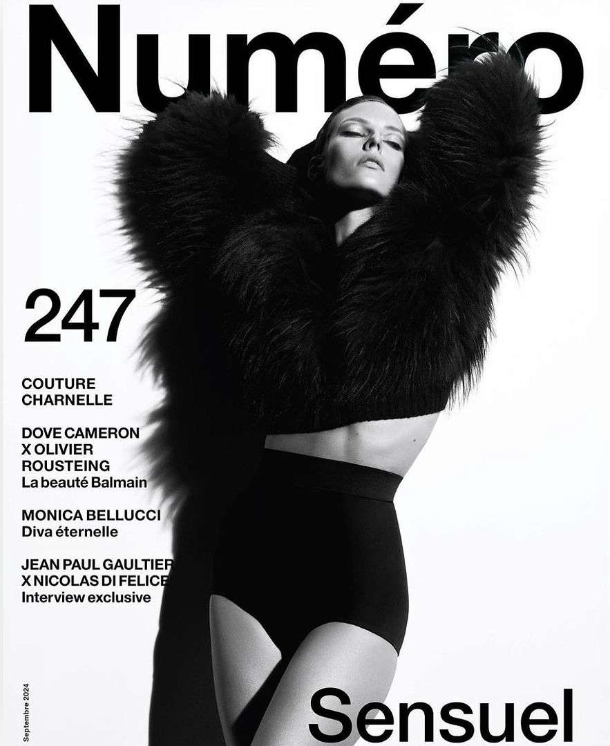 Numero magazine cover featuring a woman in a dark, fur-like coat and black bottoms against a white background with magazine text.