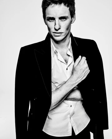 Portrait of Eddie Redmayne wearing a black jacket and white shirt by photographer Tom Munro
