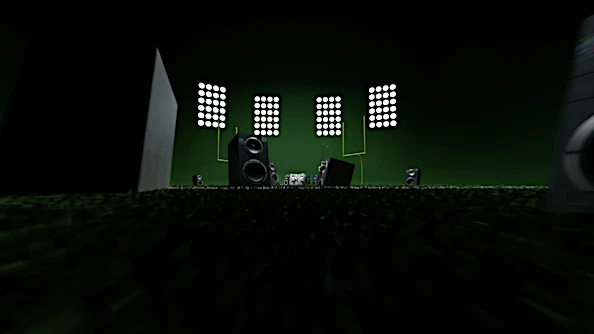 Speaker system featuring various sized speakers arranged in an indoor setting with stage lighting on a dark green background.