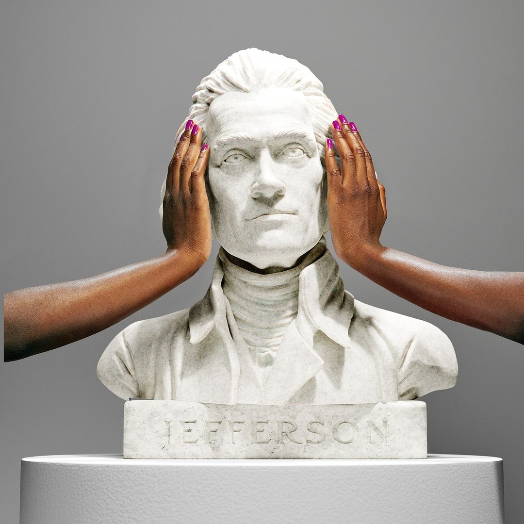 Bust of Thomas Jefferson is held by two dark-skinned hands with bright pink manicured nails against a neutral gray background.