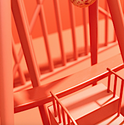 Abstract architectural design with orange structural elements, stairs, and geometric patterns. Modern and minimalist building concept.