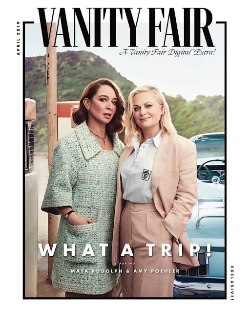 Vanity Fair cover featuring Maya Rudolph and Amy Poehler in vintage-inspired fashion, posing near a retro gas station and classic car.
