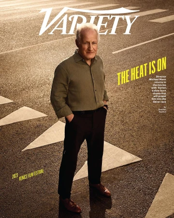 Magazine cover featuring Michael Mann on a wet city street with road markings, promoting his film 'Ferrari' at the Venice Film Festival.