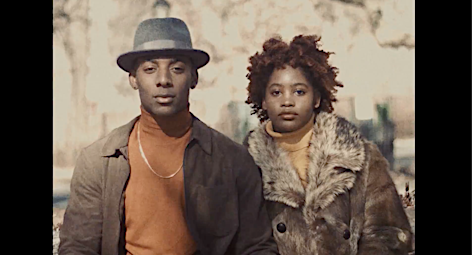 Portrait of a black man wearing a fedora and turtleneck alongside a black woman in a fur-trimmed coat by photographer Braylen Dion.
