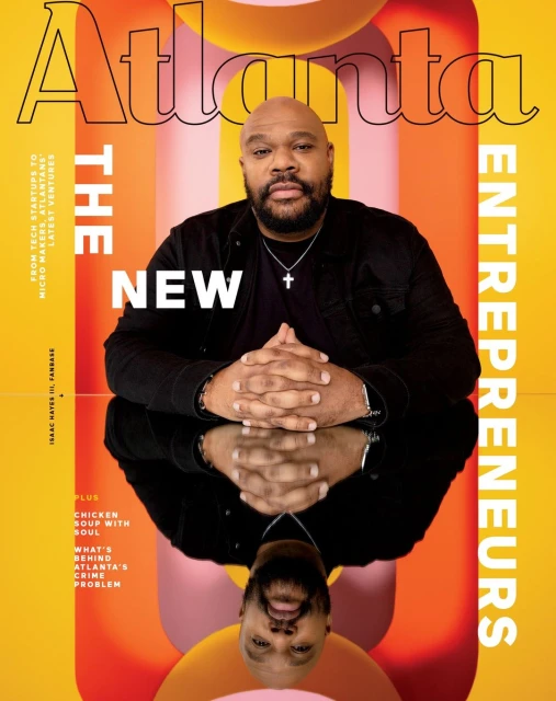 Magazine cover featuring an African-American man in a dark jacket, mirrored reflection, and 'Atlanta' title against a yellow and pink backdrop.