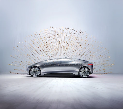 Sleek silver car showcased with a burst of golden light streaks emanating from behind, creating a futuristic, artistic automotive display.