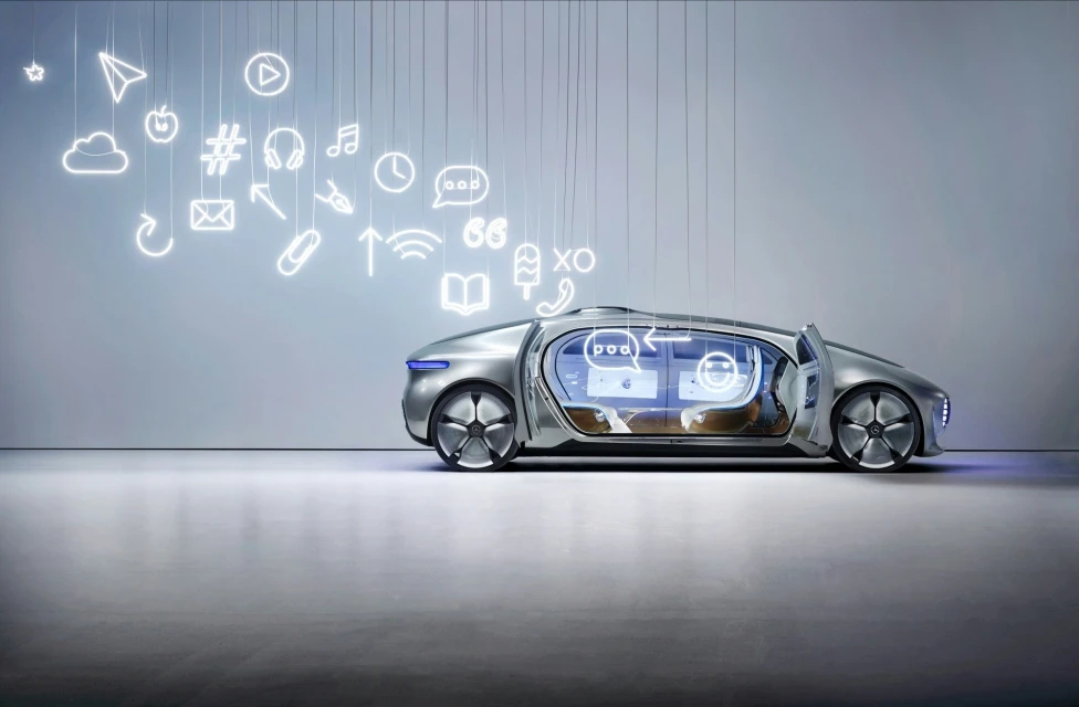 Sleek silver futuristic car with open doors parked on concrete, surrounded by illuminated social media icons above the vehicle.