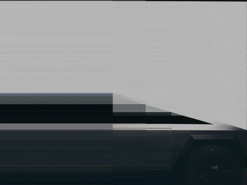 A low-angle shot showcases a sleek, partially visible, futuristic vehicle against a neutral background, emphasizing its modern design elements.