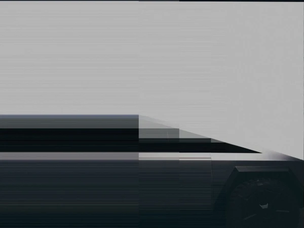 A low-angle shot showcases a sleek, partially visible, futuristic vehicle against a neutral background, emphasizing its modern design elements.