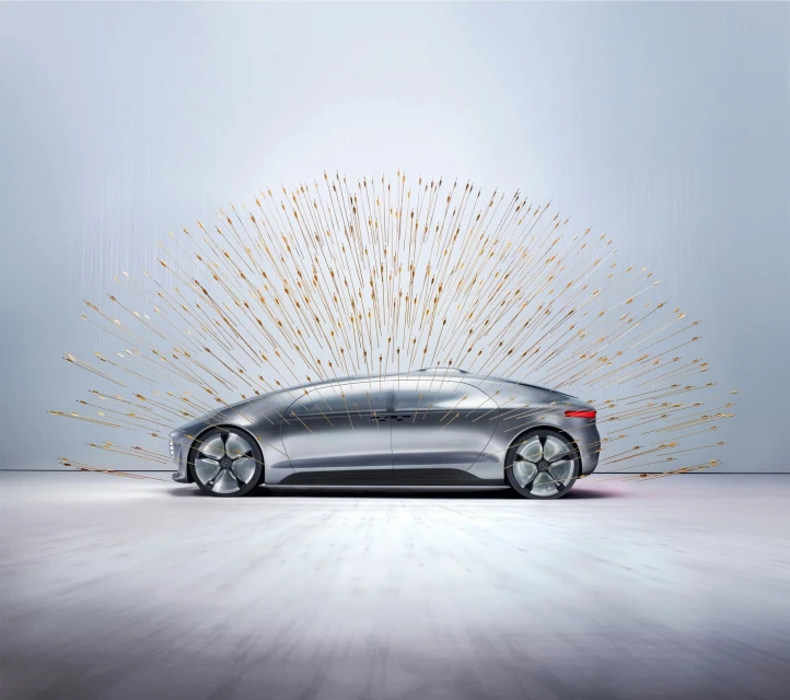 Futuristic silver car in a neutral setting, surrounded by a burst of radiating gold light for a modern, conceptual automotive image.