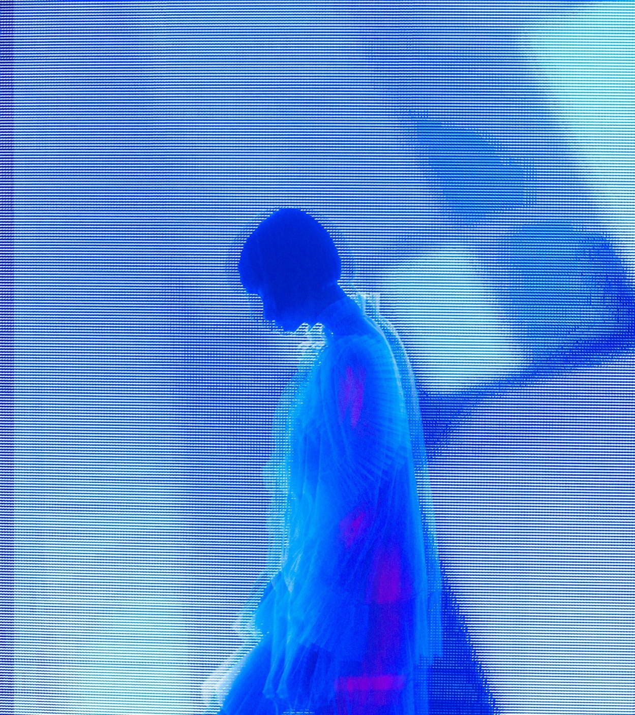 Side view of an adult female in a dress, standing against a blue background with horizontal lines, creating a visually striking composition.