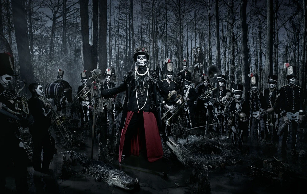 Spooky skeleton brass band with skeleton face paint performs in swampy forest among alligators in a dark, moody photograph.