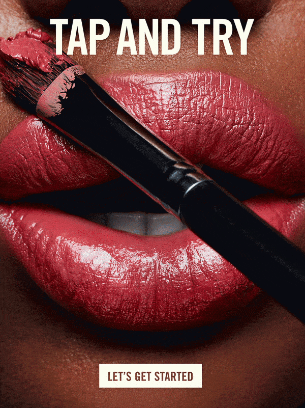 Close-up of lips with lipstick and makeup brush. Beauty shot for beauty and fashion industries, with a dark background and bright studio lighting.
