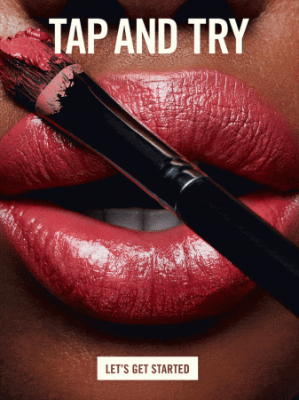 Close-up of lips with lipstick and makeup brush. Beauty shot for beauty and fashion industries, with a dark background and bright studio lighting.
