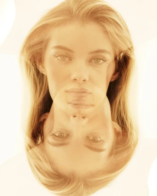 Portrait of a fair-skinned woman with blonde hair, duplicated and inverted with a blurred effect, creating an ethereal, mirrored composition.