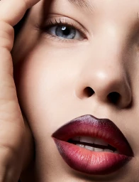 Extreme close up beauty portrait of a woman with dark ombre lips and blue eyes, directed by Bri Johnson
