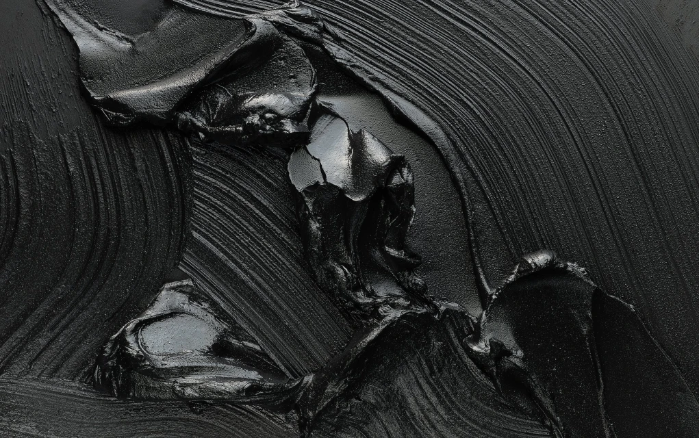 Black abstract painting featuring thick brushstrokes and glossy texture, creating a dramatic, monochromatic artwork with dynamic lines and depth.