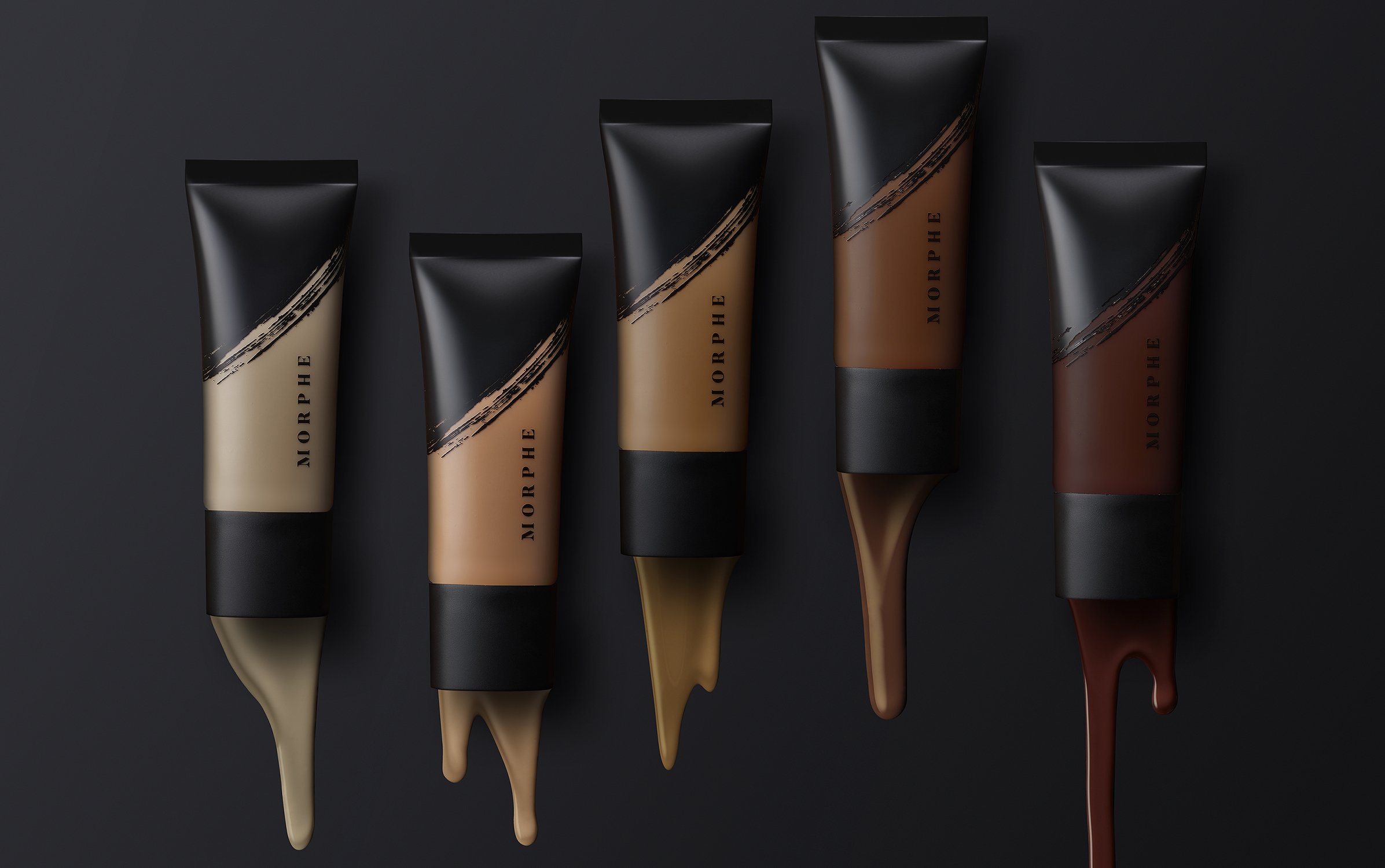 Cosmetic tubes of foundation in various shades with viscous product dripping, against a black background, beauty and cosmetics concept.